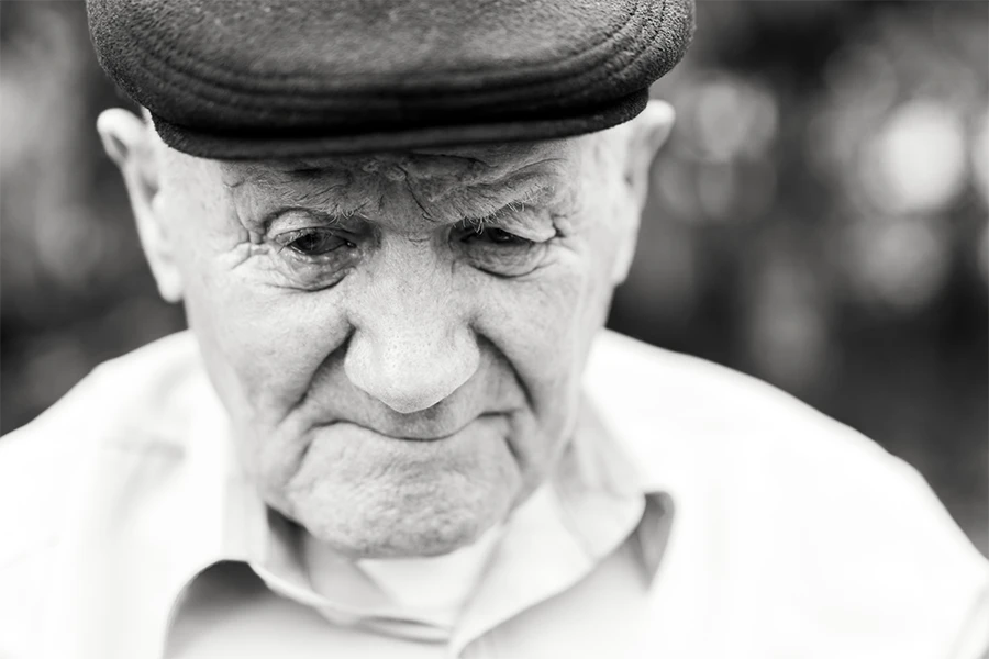 Black & White Image of an Old Man Looking Troubled